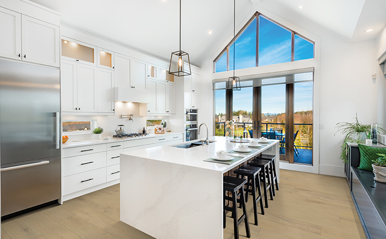 engineered hardwood in kitchen with big window and white island